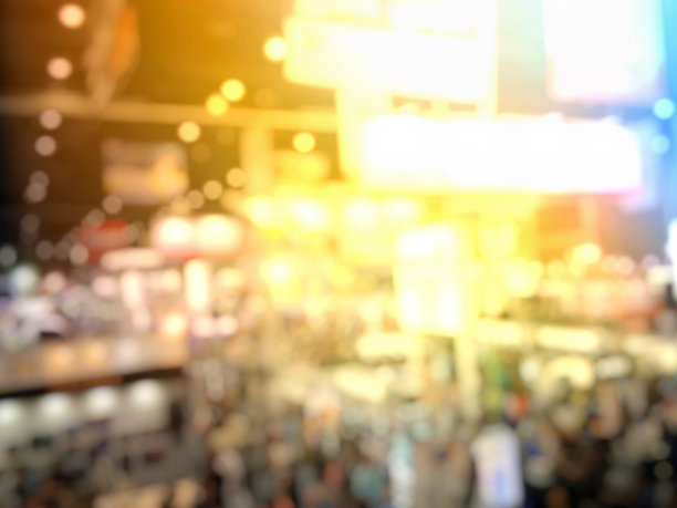 模糊形象的人在活动背景与电子科技照片展散光复古色调-经营理念图片下载