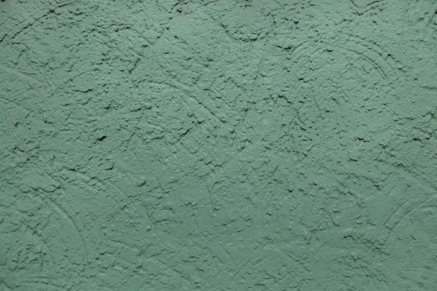 绿色粉刷的灰泥墙。背景纹理图片下载