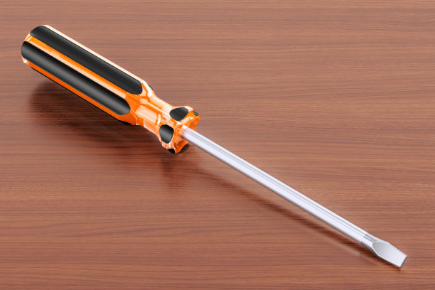 把螺丝刀放在木桌上。三维渲染图片下载