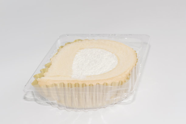 白色背景的容器中的蛋糕。图片下载