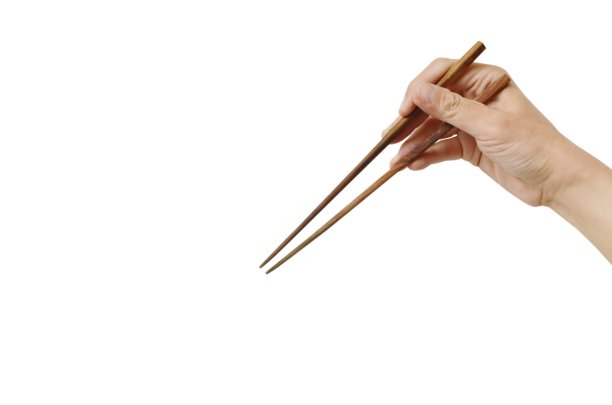 手拿筷子在白色的背景图片下载