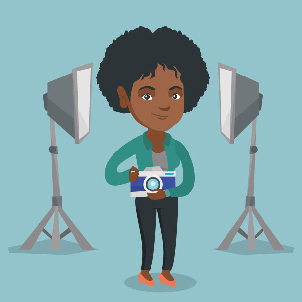 摄影棚里带着相机的摄影师图片下载