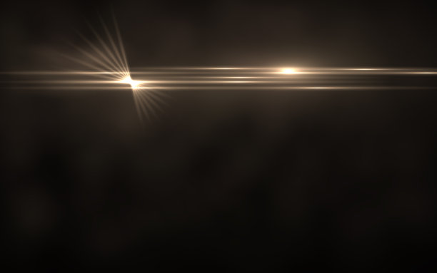 照明光斑的抽象图像。抽象的太阳爆发与数字镜头耀斑背景。黄金自然闪光效应图片下载