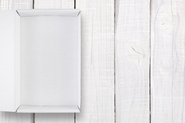 打开白色盒子盖上白色木质背景顶视图图片下载