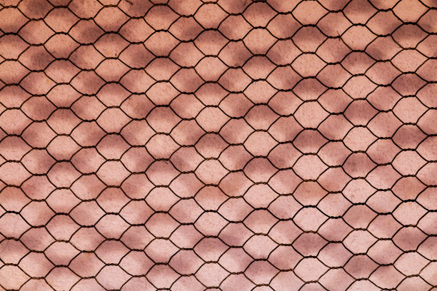 生锈的双层六角丝网背景图片下载