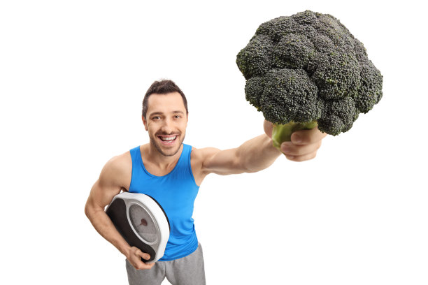 一个拿着体重秤和花椰菜的运动员图片下载