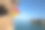 女攀岩者在海边悬崖上攀岩素材图片