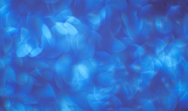 美丽的蓝色背景与白色的散景图片下载