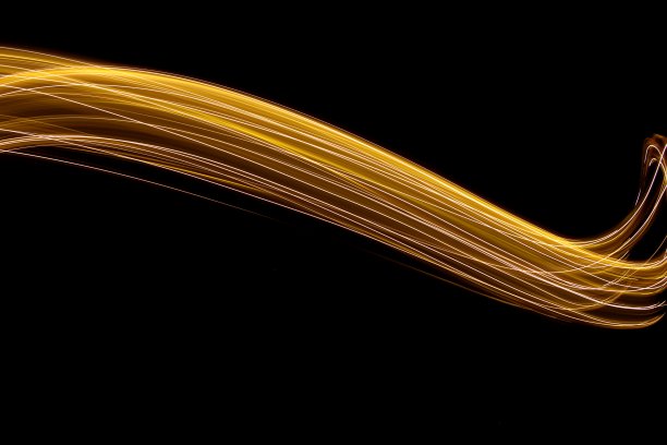 金光绘画摄影，光线流，长曝光照片，以黑色为背景图片下载