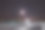 冬夜白雪覆盖的道路。围绕着寂静的星空和月亮的光环。图片下载