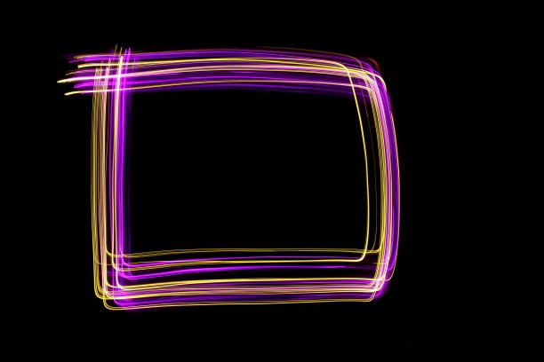粉色和金色的光画摄影，一个方盒子的轮廓，长曝光照片，以黑色为背景图片下载