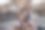 微笑的年轻女子坐在健身房喝水素材图片