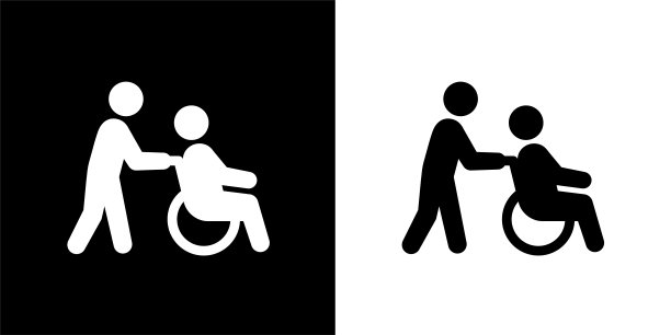 与老年轮椅同行的医护人员。图片下载