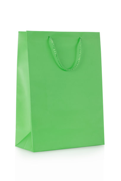 绿色购物袋在纸上白色图片下载