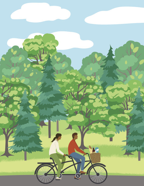 一对在公园小路上骑自行车的夫妇图片下载