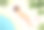 年轻女子在海滩上晒日光浴图片下载