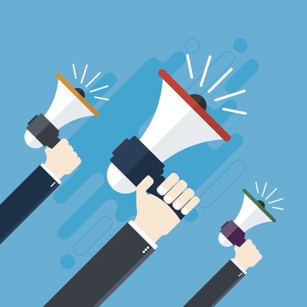 手拿着扩音器。素材图片