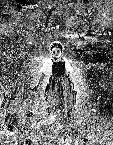 年轻快乐的女人走在春日鲜花盛开的草地上图片下载