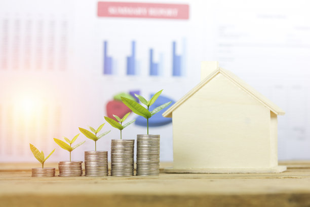 以图形纸为背景，讲述了金钱和树木的成长和家园，概念为储蓄、金融、帐户、买卖房子图片下载