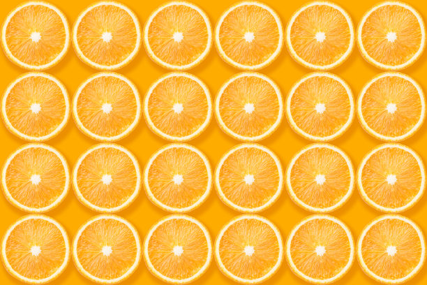 橙色切片在黄色上图片下载