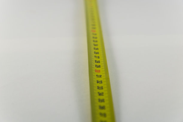 黄色卷尺，厘米。测量工具设备。背景图片下载