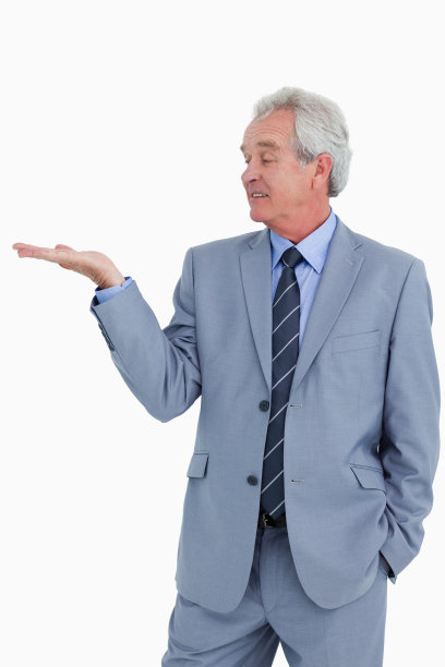 成熟的商人看着他的手掌图片下载