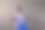 一个，年轻的成年人，非洲裔美国人，女性，20-29岁，看着镜头，在户外灰色的墙壁，穿着蓝色的衣服，微笑着，手放在臀部图片下载