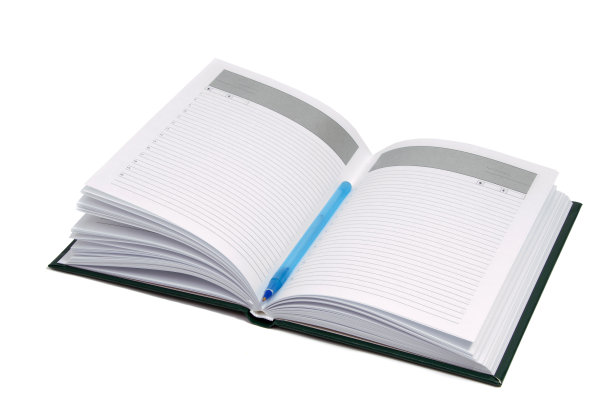 打开笔记本孤立的白色背景。一个商人的日记。图片下载