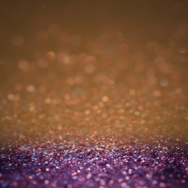 散焦闪光复古灯背景。橙色，紫色和黑色作为圣诞和新年的背景。图片下载