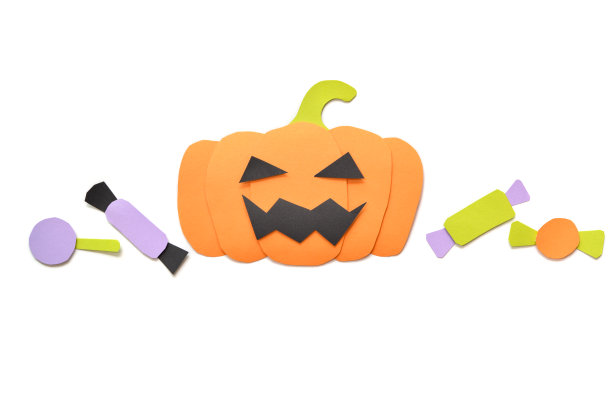 万圣节南瓜与糖果在白色的背景图片下载