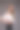迷人的女人在白色衬衫摆姿势在灰色的背景图片下载