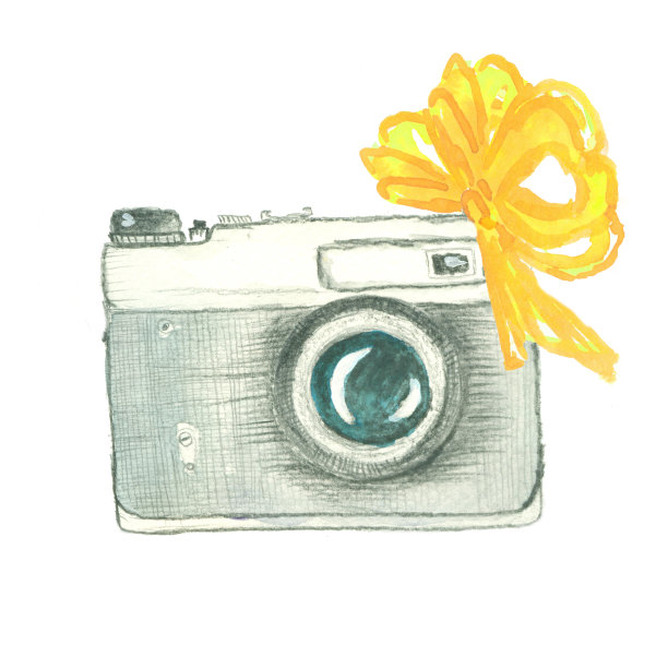 带黄色蝴蝶结的老式相机图片下载