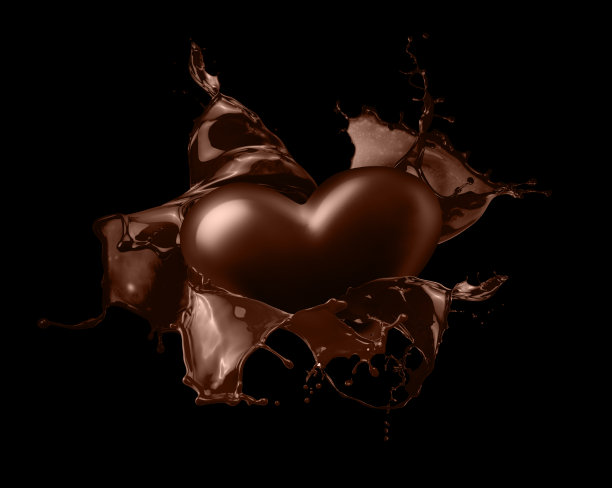 黑色背景上点缀着心形巧克力图片下载