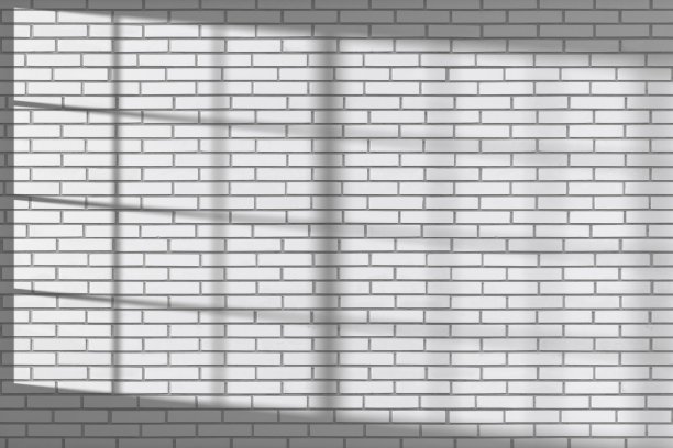 白色砖墙，阳光透过窗户图片下载