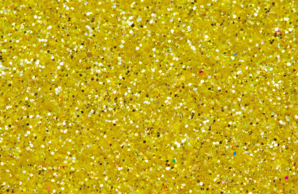 黄色的抽象背景。金色闪光特写照片。金光闪闪的包装纸。图片下载