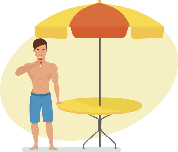 一名男子站在夏日咖啡馆附近喝着水果鸡尾酒图片下载