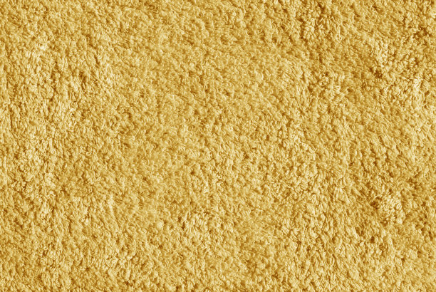 橙色浴巾表面。图片下载