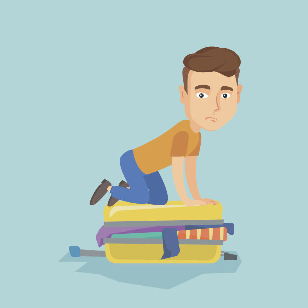 年轻人试图合上行李箱图片下载