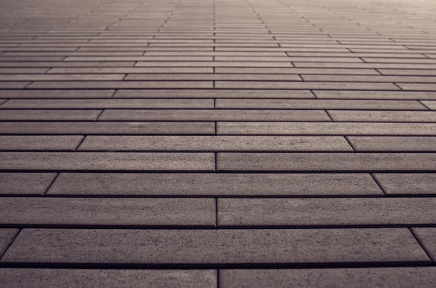 城市背景的棕色砖墙，特写背景。图片下载