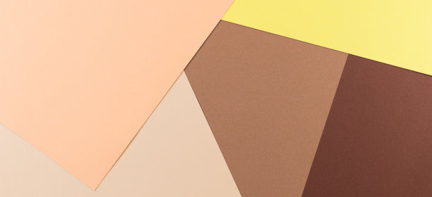 摘要彩色纸横幅背景。粉彩棕色，米色和黄色纸背景图片下载