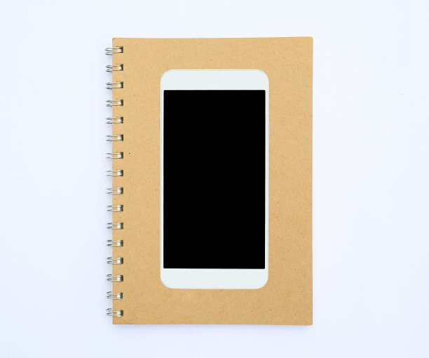 智能手机上的回收棕色笔记本白色背景。图片下载