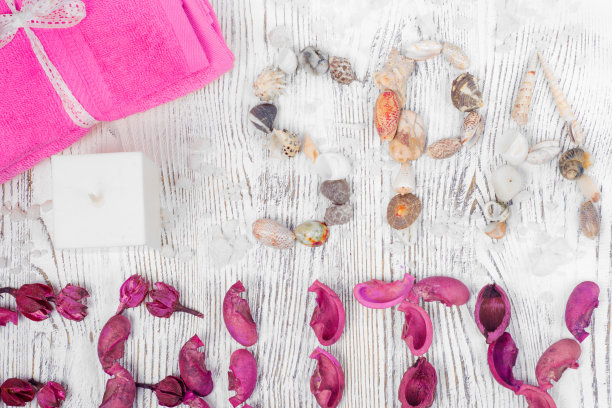 美容温泉毛巾、蜡烛、奶油、鲜花图片下载