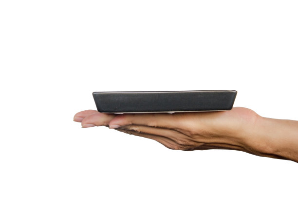 手握黑色板孤立在白色背景。剪切路径。图片下载