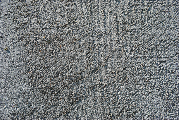 灰色的混凝土墙。表面有小裂缝图片下载