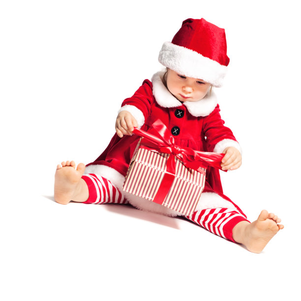 圣诞小孩在圣诞帽和大礼盒图片下载