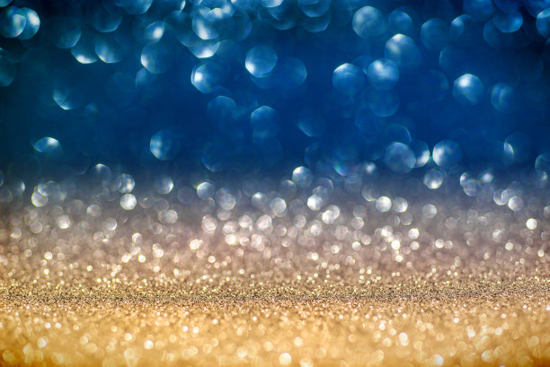 圣诞闪亮的背景-金色和蓝色散景的闪光效果图片下载