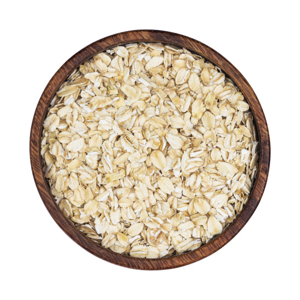 木碗中的燕麦片孤立在白色背景上。俯视图素材图片