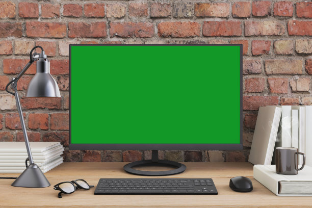 办公桌与大型PC电脑屏幕与绿色背景-模板图片下载