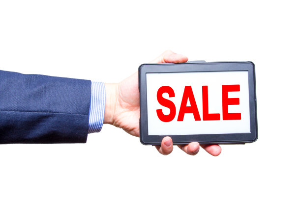 商人手持平板与销售文字标志。孤立在白色的。经营理念。年轻人。库存图片图片下载