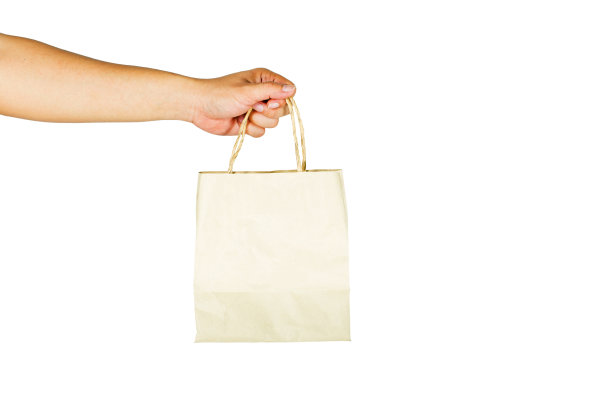 手势是在白色背景下拿着一个纸袋。剪切路径。图片下载